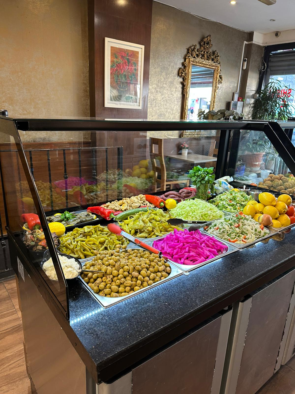 Fresh mezze and pickles display at Al-Saha