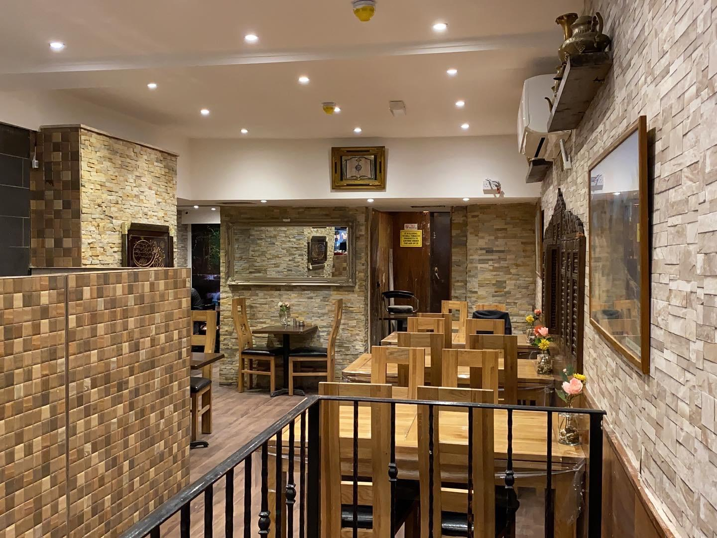 Al-Saha dining room interior with wooden tables